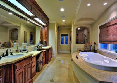 Large dark wood bathroom with spa tub