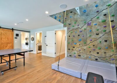 Recreation room with rock climbing wall