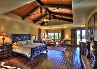 Master bedroom with dark wood trusses